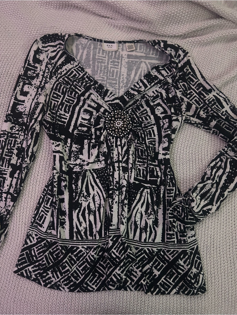 ECI Black and White V-Neck Long Sleeve Patterned Top with Brooch